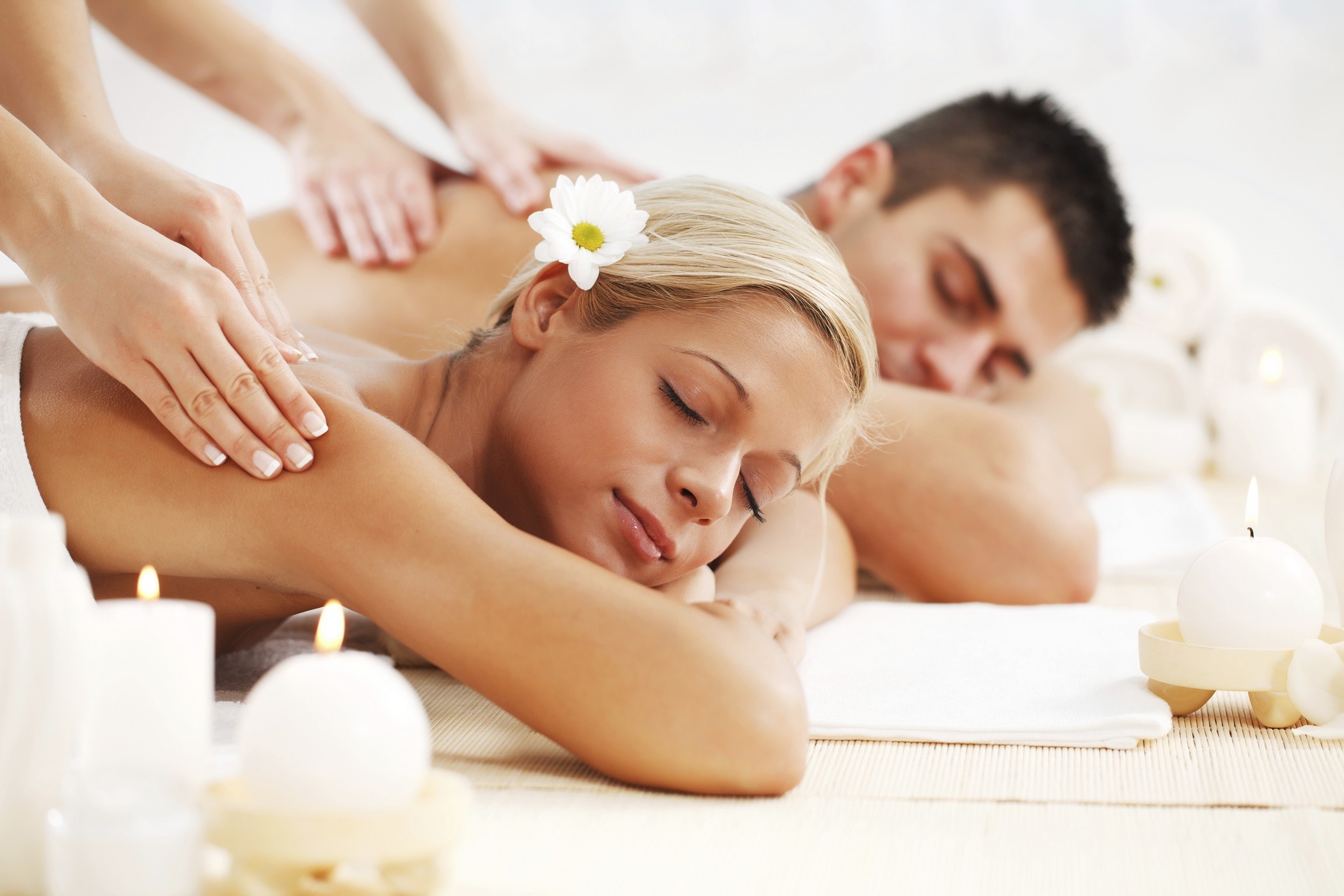 Young couple is having a back massage at the spa centre. 

[url=http://www.istockphoto.com/search/lightbox/9786786][img]http://dl.dropbox.com/u/40117171/couples.jpg[/img][/url]